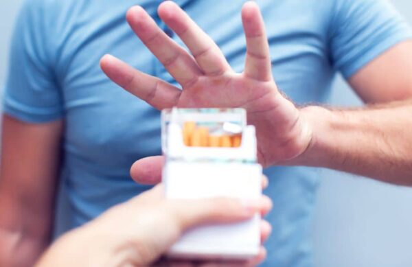 Man avoiding cigarettes.